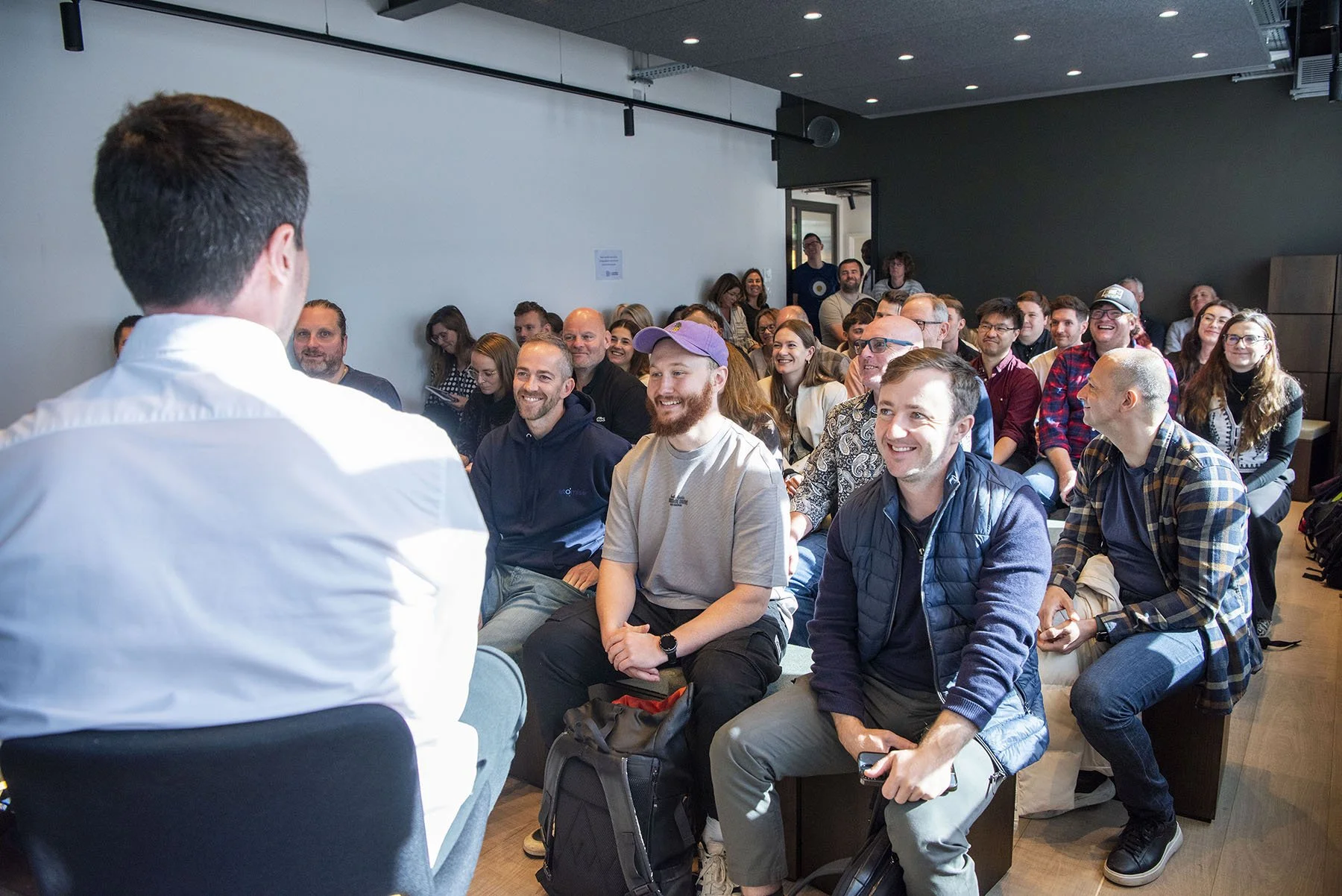 A photo of an engaged audience during the event 'Let's talk about CX'.