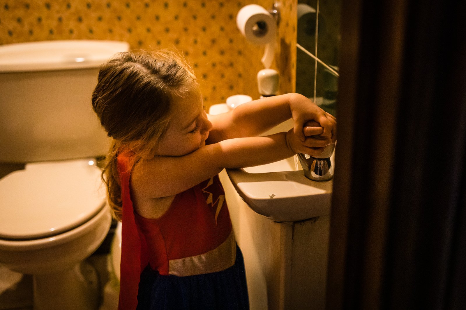 Supergirl washes her hands