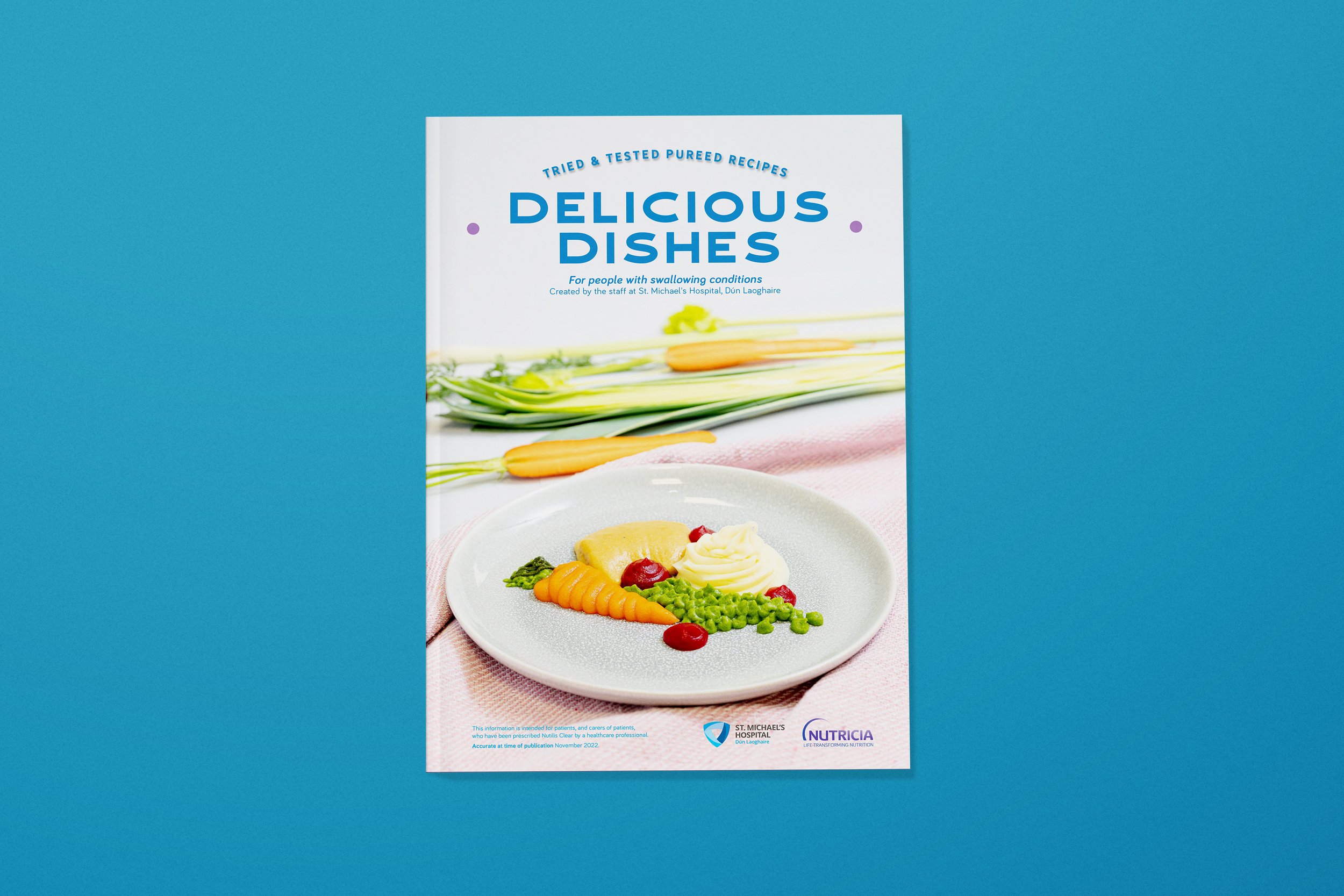 The Delicious Dishes Recipe Book designed for Nutricia and St Michael's Hospital. Designed by Designfolk Consultants.