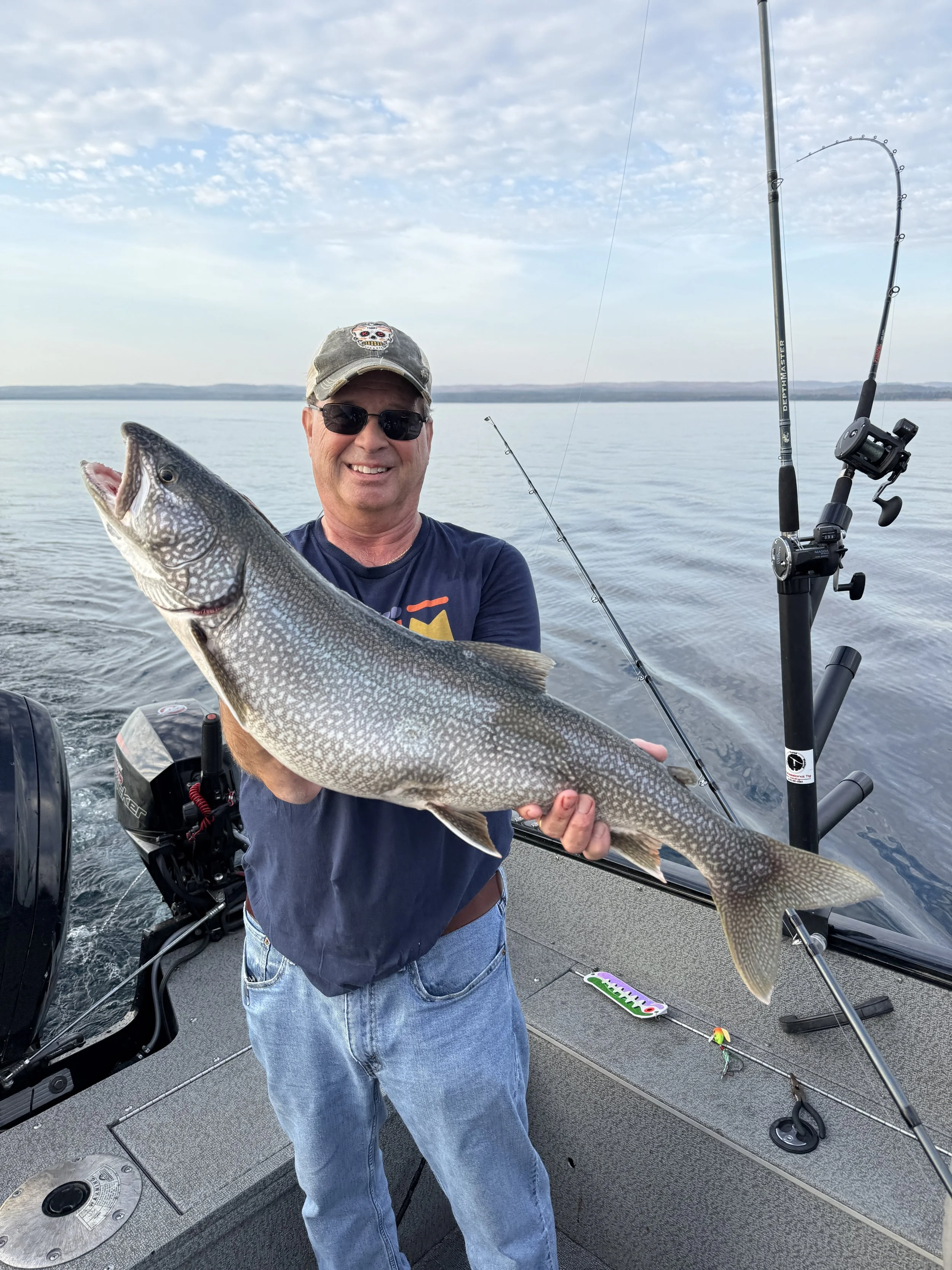 Customer holding a Lake Trout