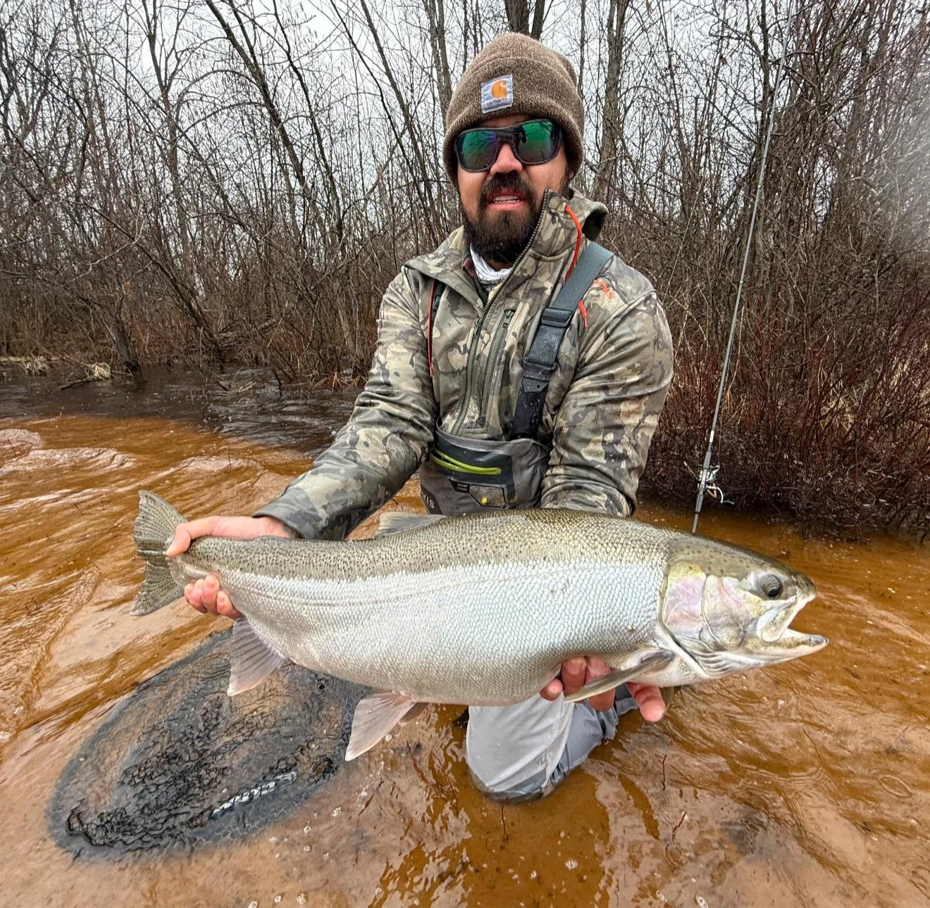 Captains Mike and Nate hold recent catch's in Lake Michigan tributaries on a guided river fishing trip