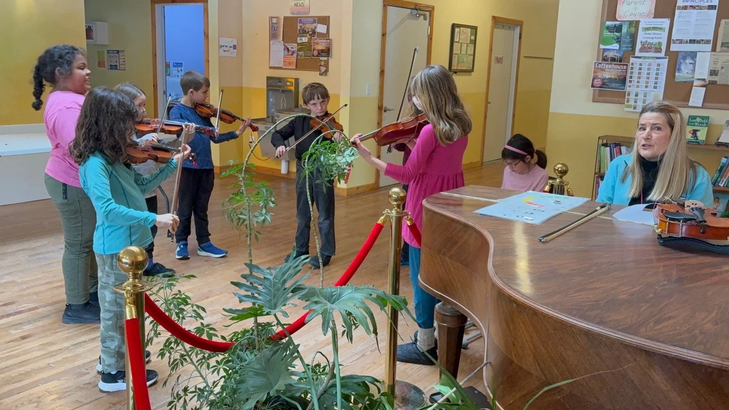 Our 3rd grade violin ensemble rehearsed in the hallway this week, to the delight of our office staff--the building was ringing with the vibrations!⁠
⁠
All our 3rd graders choose a fretless string instrument, and begin private lessons as well as strin