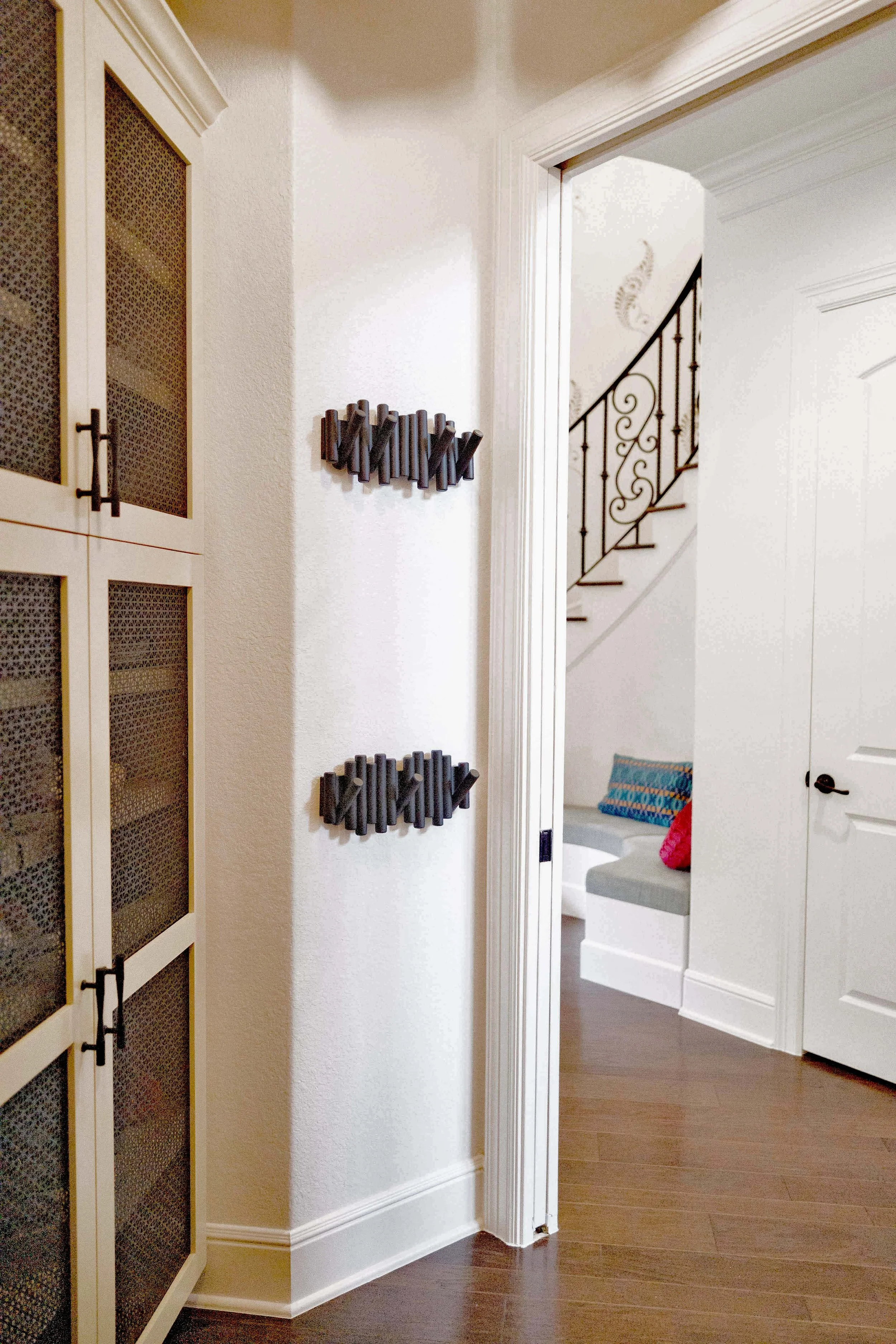 A Mudroom that is not practical is a total waste. These mesh-lined cabinets allow shoes to 'breathe' so there is no odor to worry about - vitally important when you have boys' soccer shoes to house! And hooks on the wall don't have to be boring - the
