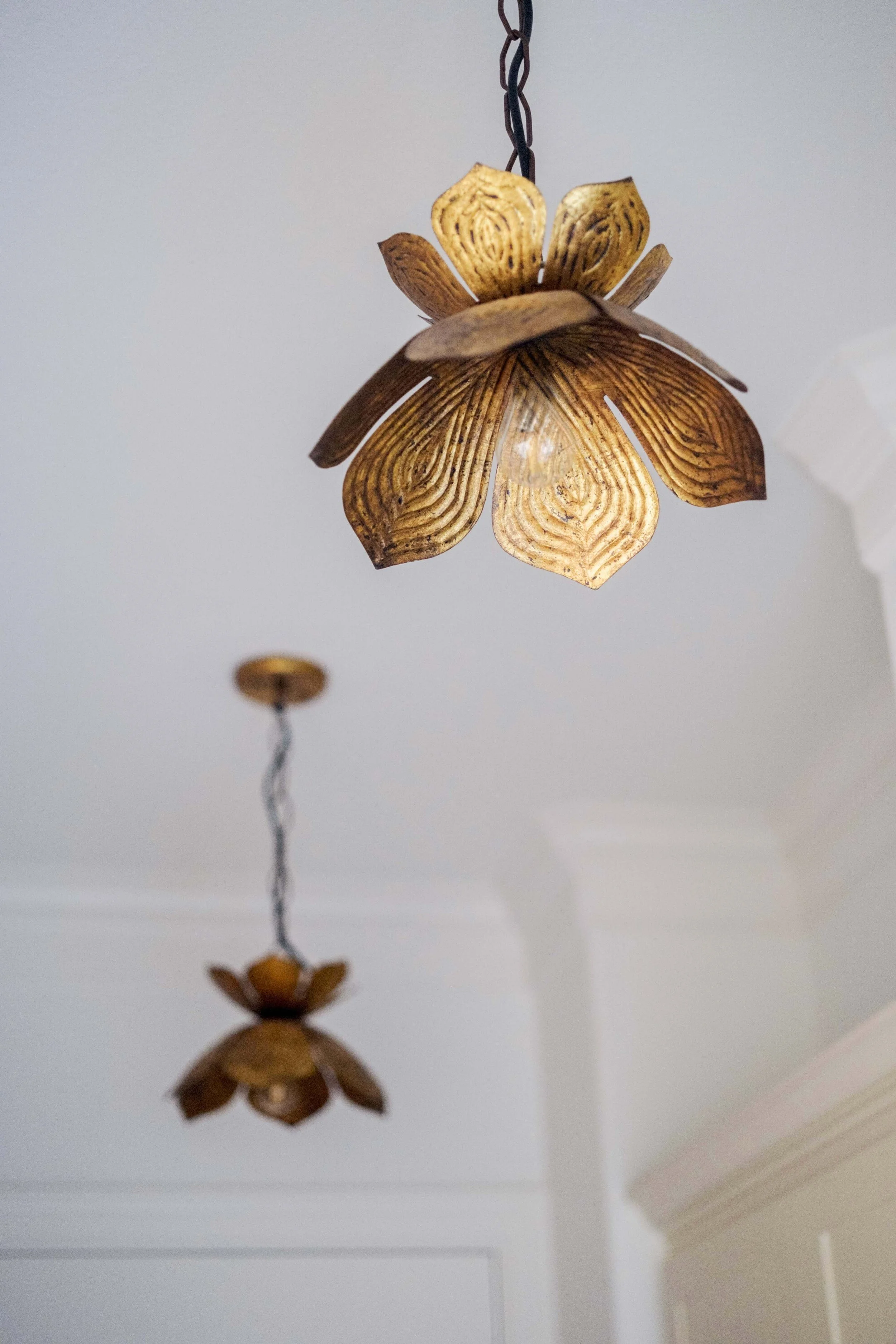 These lotus pendants replaced the (Awful? Boring?) recessed can lights that used to be in the Mudroom and provided both light and personality. Set on a motion detector, they turn on as soon as someone walks in for added convenience.