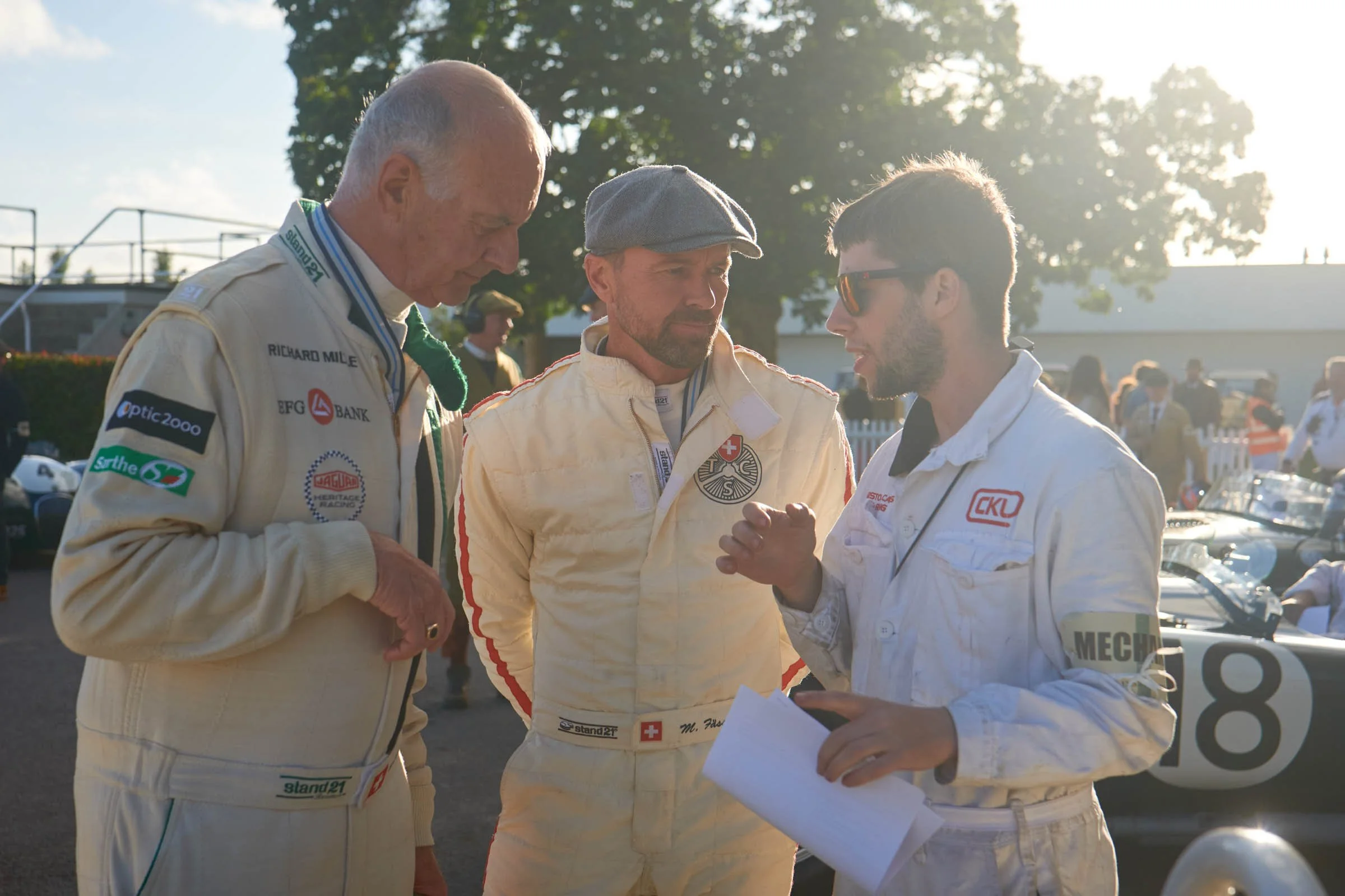 Toby briefs the C-type driver pair of Hans-Martin Schneeberger and Marcel Fassler (3x Le Mans winner) ahead of the Freddie March Memorial Trophy