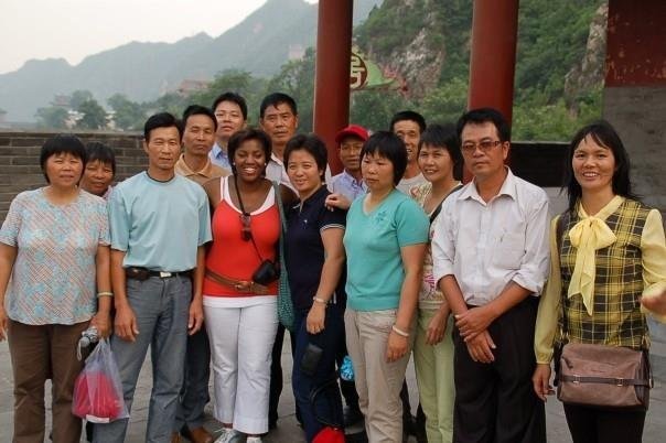 2006 OU Journey to China - Mary with new friends following climbing the Great Wall of China (Copy)