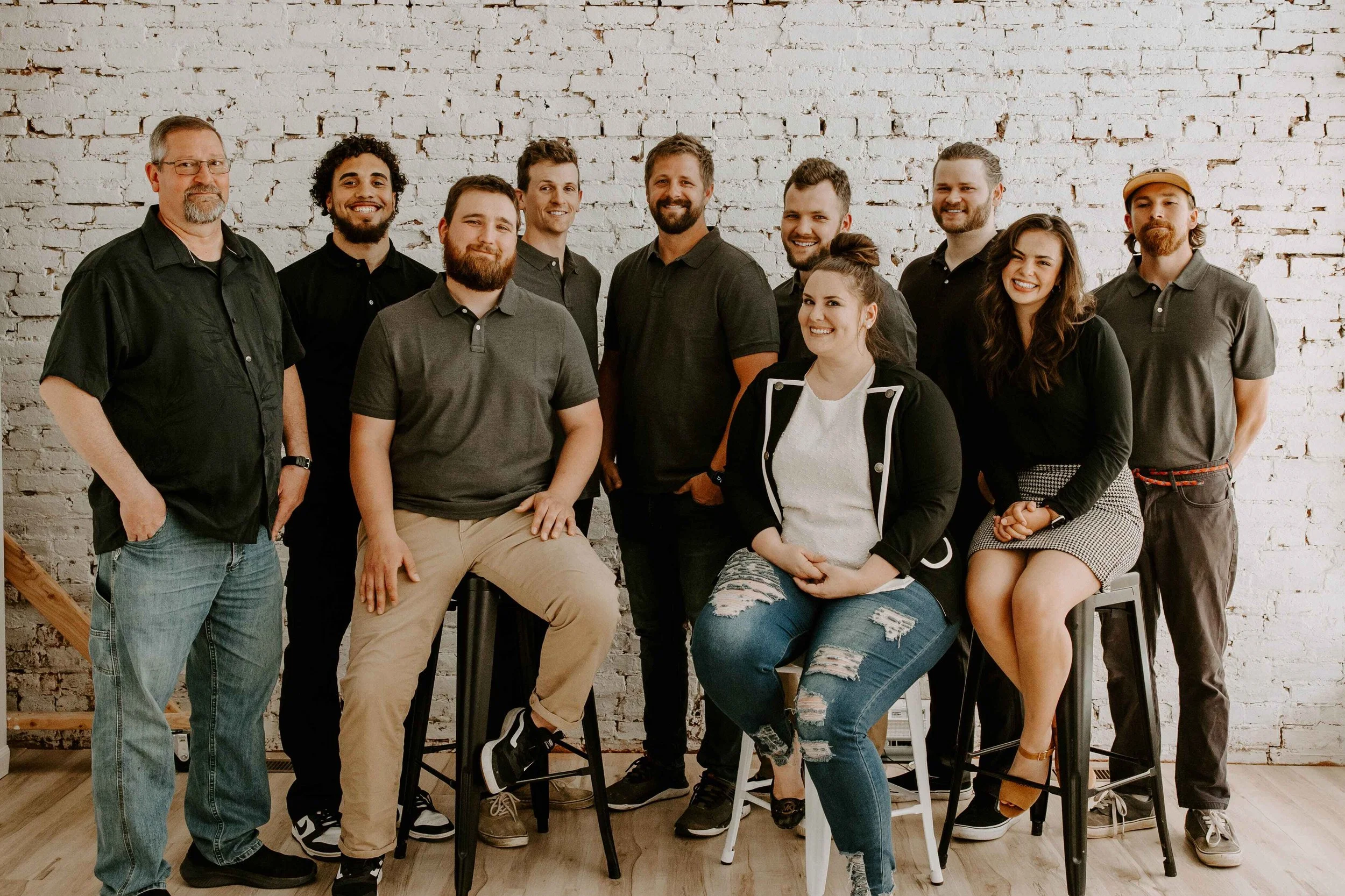 Team of ten Vatter Construction professionals posing together for a group portrait as a trusted contractor in Lancaster.