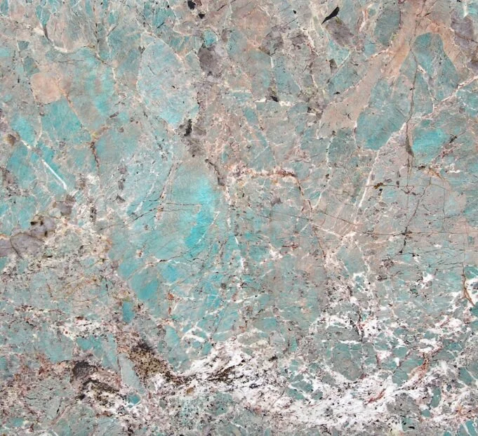 Luxury polished quartzite surface featuring layered turquoise, emerald green, gray, and beige mineral patterns with crystalline veins.