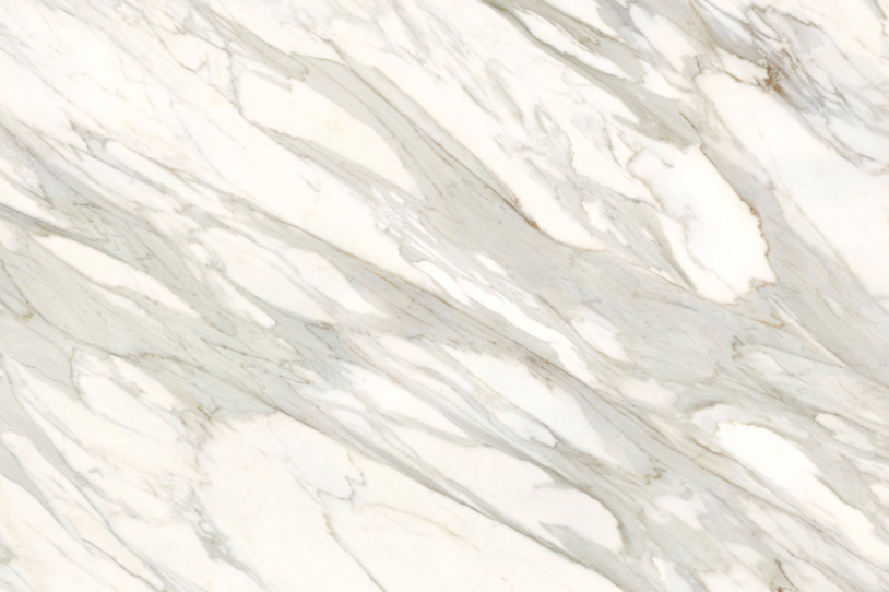 Calacatta Gold marble slab with sweeping gray veins and warm gold accents flowing diagonally across its bright white surface.