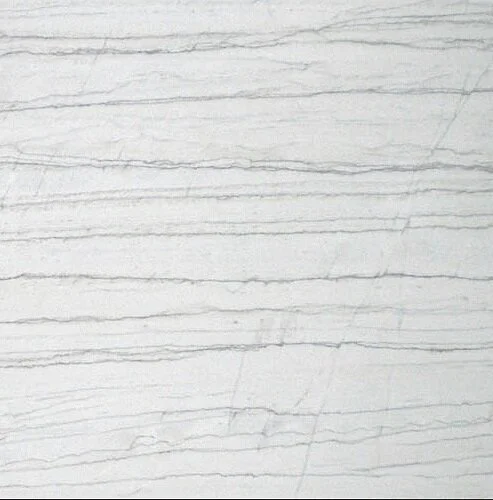 Close-up of a polished White Macaubus Quartzite slab with crisp white tones and distinctive horizontal gray veining.