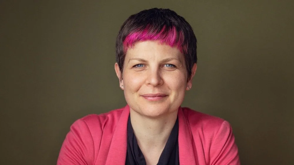 Mayor Zoë Garbett smiling to camera wearing a pink jacket