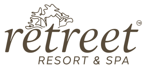 Retreat Resort & Spa logo with a silhouette of a mountain and trees above the text.