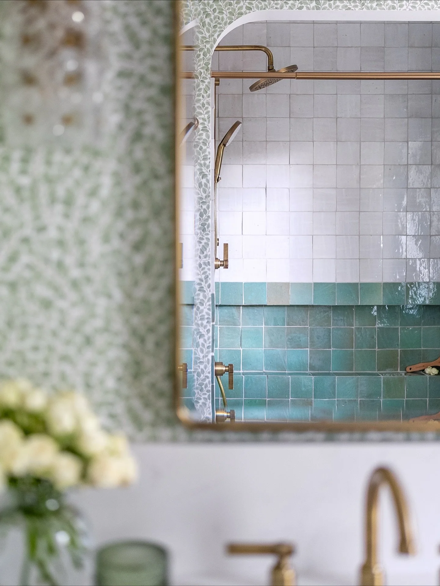 This one is special. A project where trust met creativity with full grace from the homeowner to take control and dive deep into the details.

Arches above the alcove tub, two-tone handmade tile, botanical wallpaper, a radius vanity backsplash, playfu