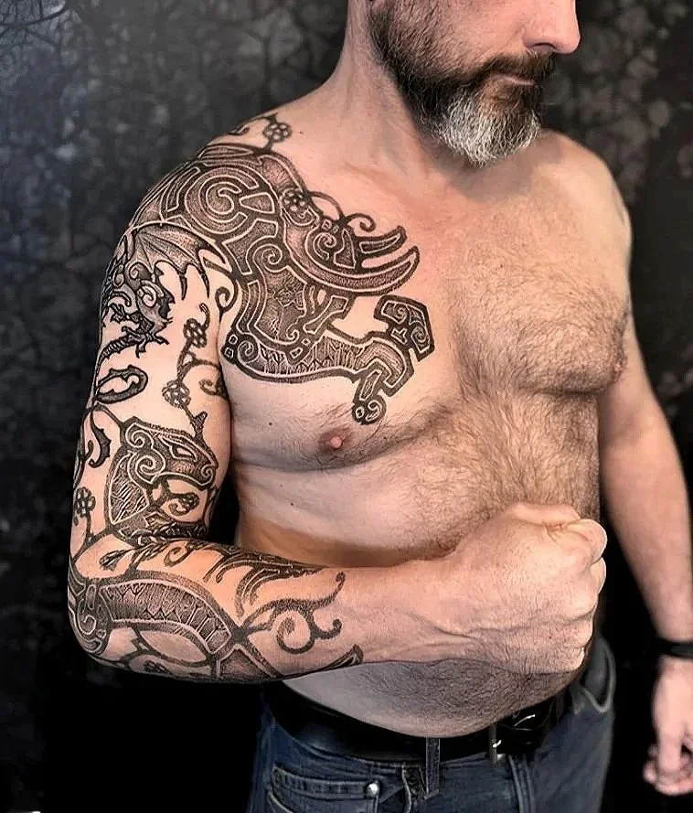 Neo Nordic Chest and full sleeve tattoo. Nordic inspired art, Nordic mythology, Mjolnir, Bull, Dragon, Nordic Beast, Viking runes, sacred art, black ink