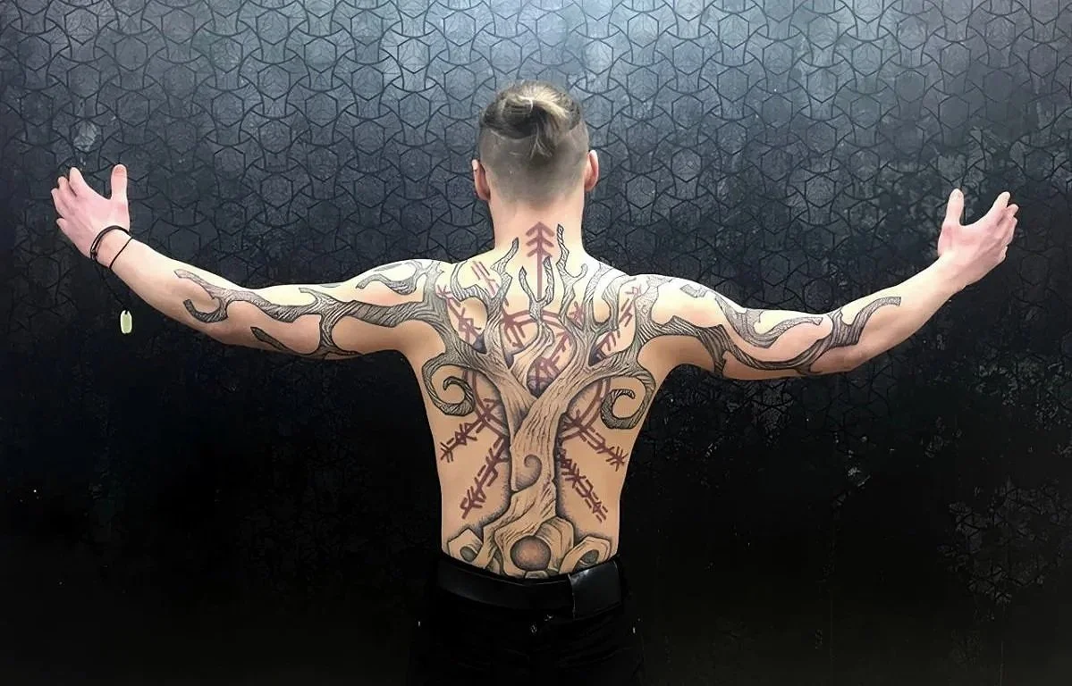 Neo Nordic inspired Tree and Runes back piece tattoo. Full back tattoo, hand drawn design, Tree of knowledge, Runes, sacred art, black ink, red ink