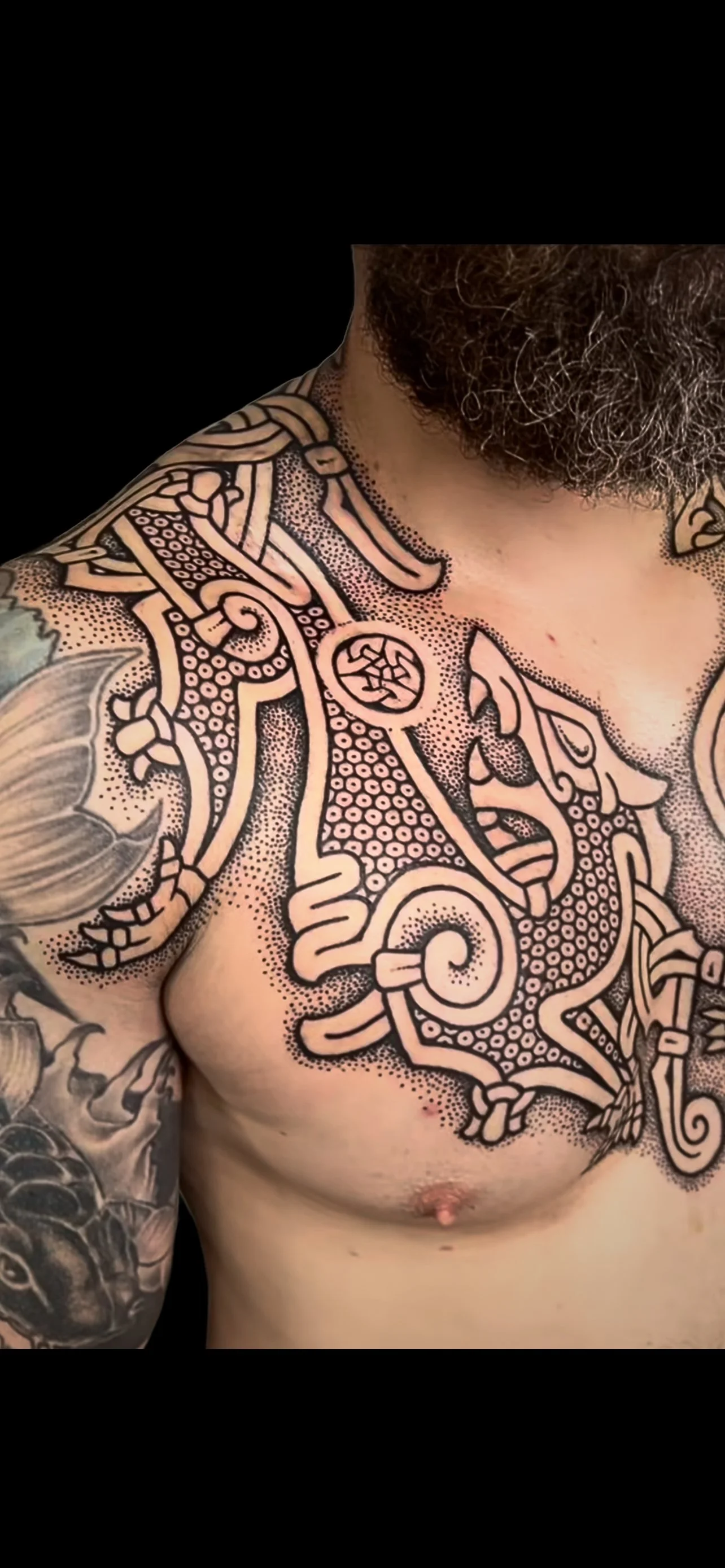Sean skoll and hati chest piece black background.jpg