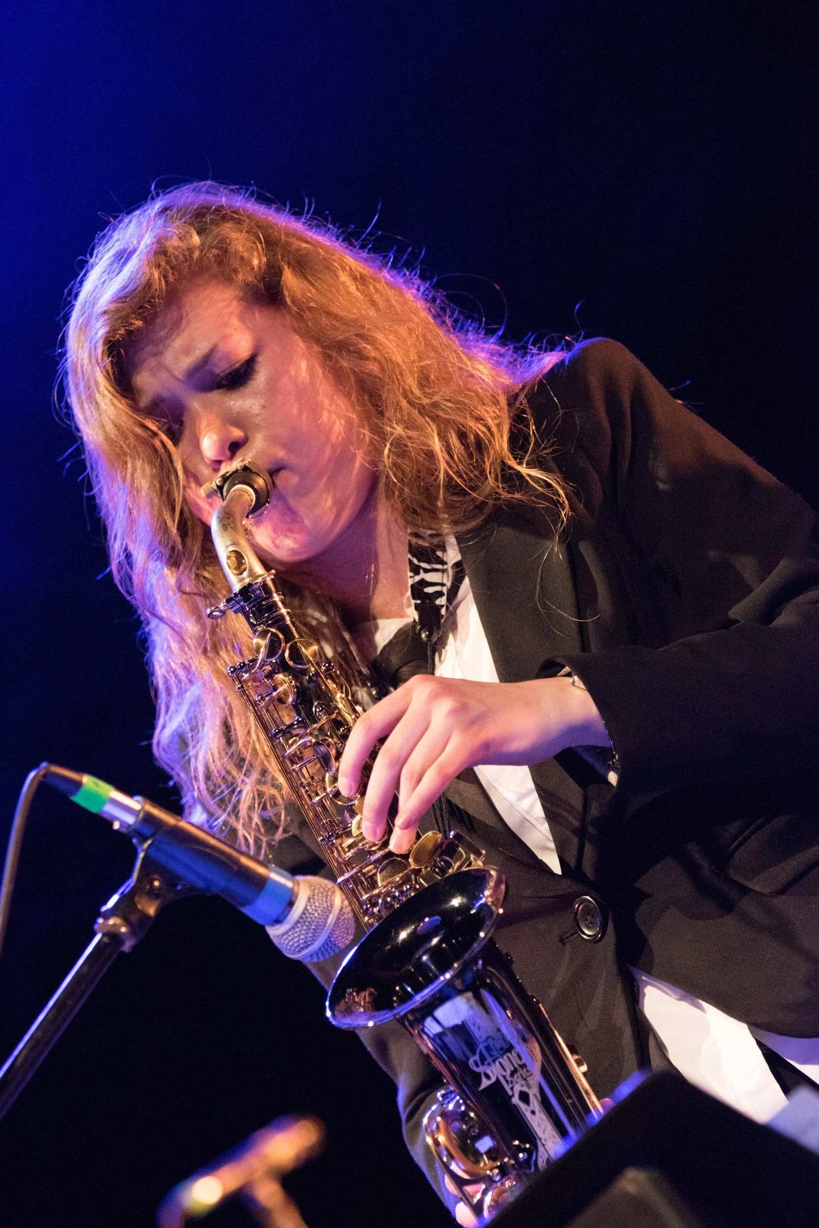 Young saxophonist performing on stage