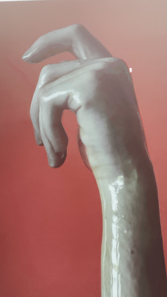Sculpted hand on red background