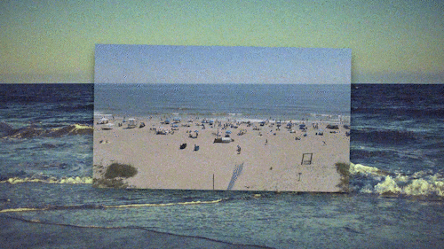 Digital glitch showing overlapping images of a sandy beach with boats, umbrellas, and a blue ocean, with the beach scene partly overlaid onto an ocean background.