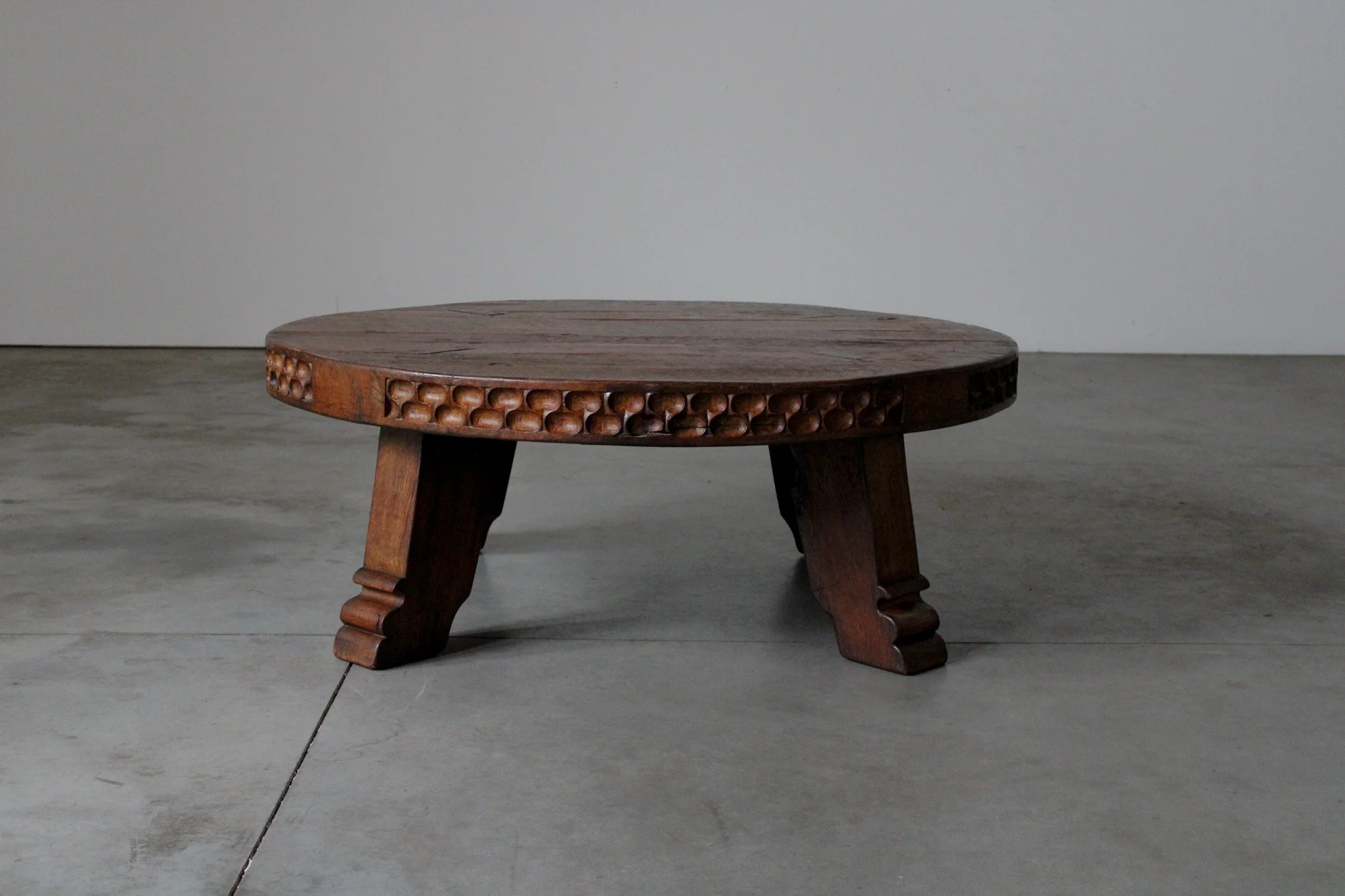 Carved rustic oak round coffee table