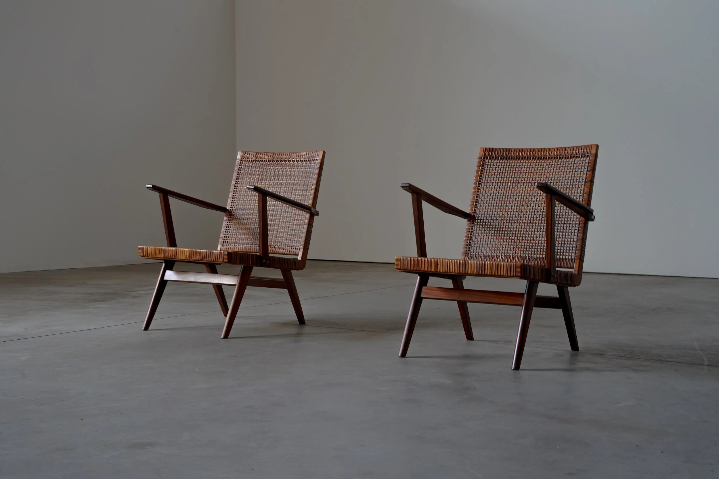 PAIR OF TEAK AND WEBBING ARM CHAIRS
