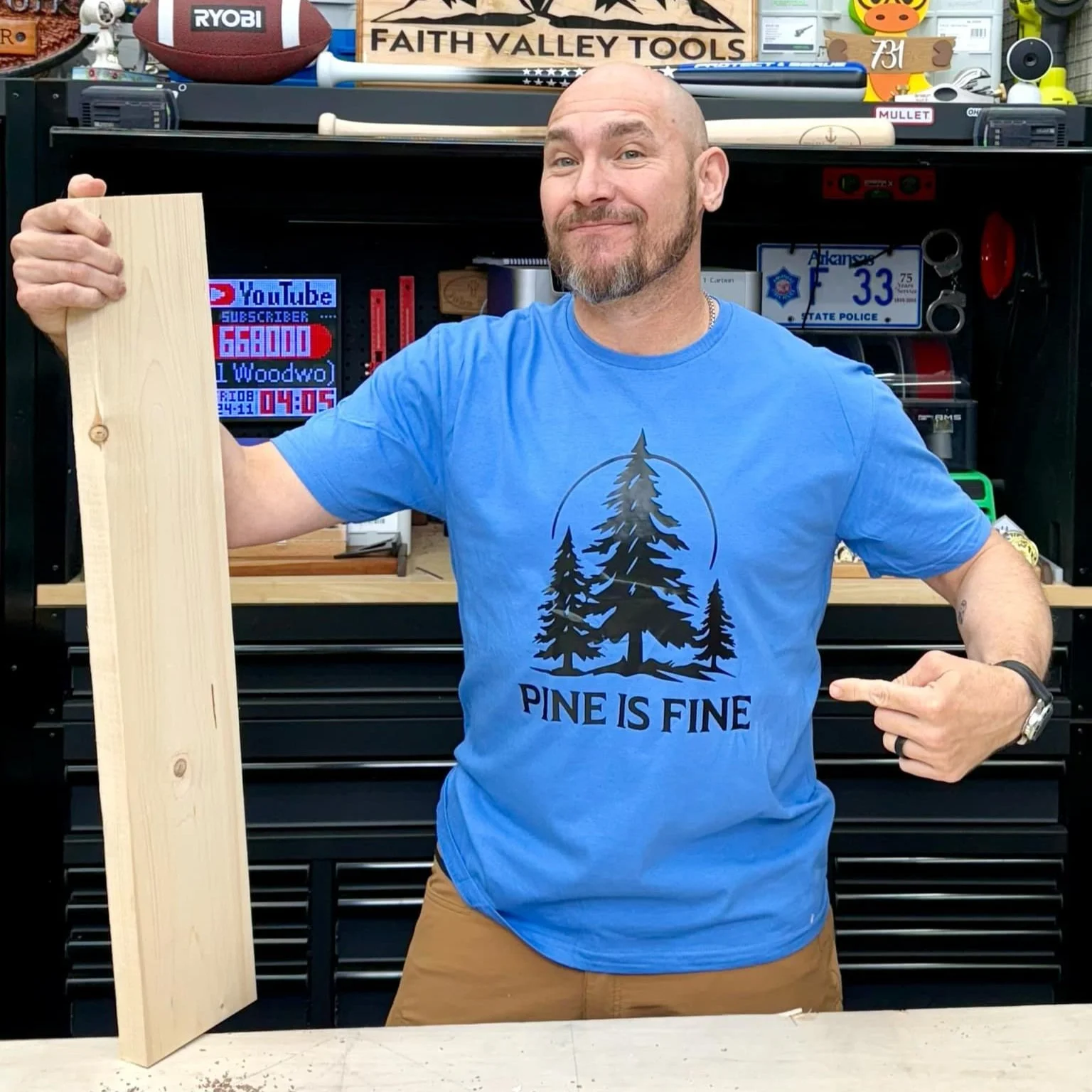 Matt Outlaw from 731 Woodworks wearing a blue Pine is Fine t-shirt.