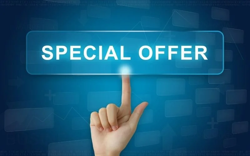 A person's hand pointing at a digital screen with the text 'SPECIAL OFFER' illuminated.