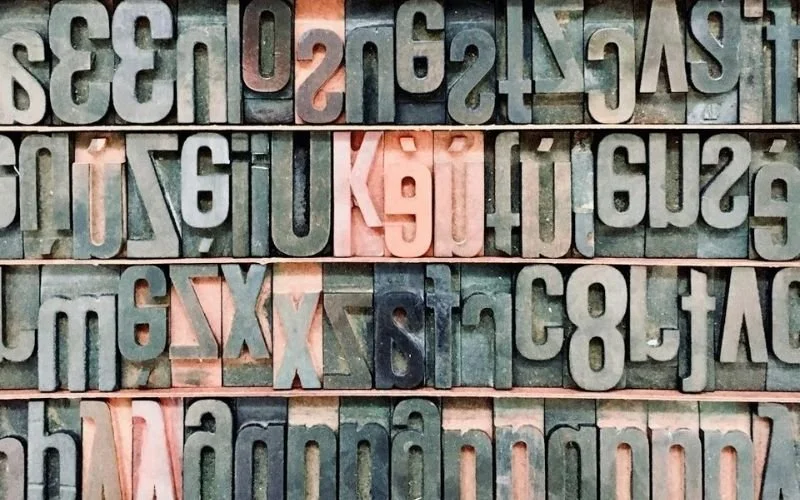 close-up, top-down view of vintage wooden printing blocks