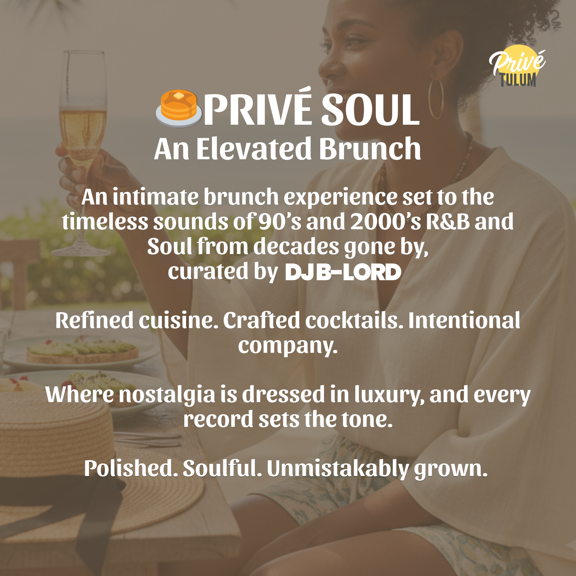 A woman at a brunch table holding a glass of champagne, with food and a straw hat on the table, outdoor setting.