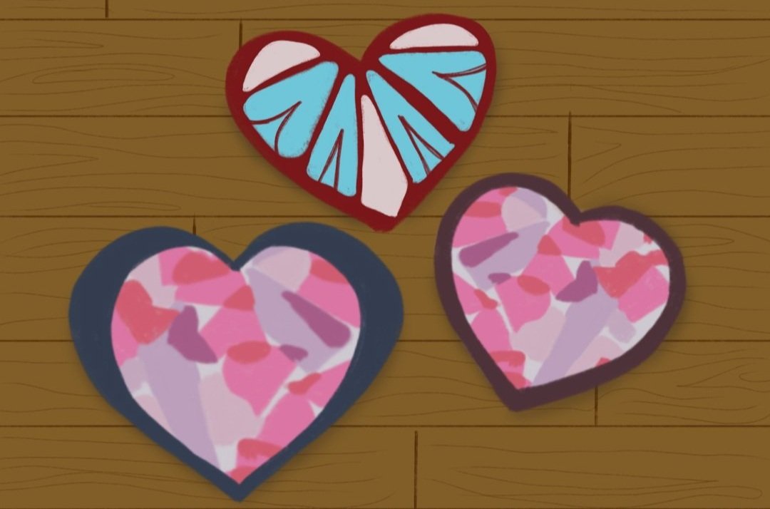 Three hearts on a plank background