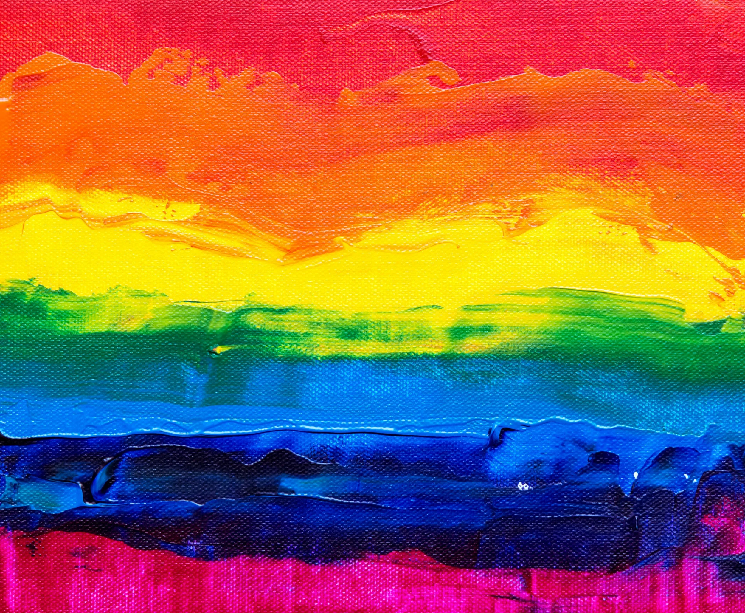 A textured canvas with the colors of the LGBTQ+ Pride flag painted on it. From top to bottom; Red, orange, yellow, green, light blue, dark blue, and purple.