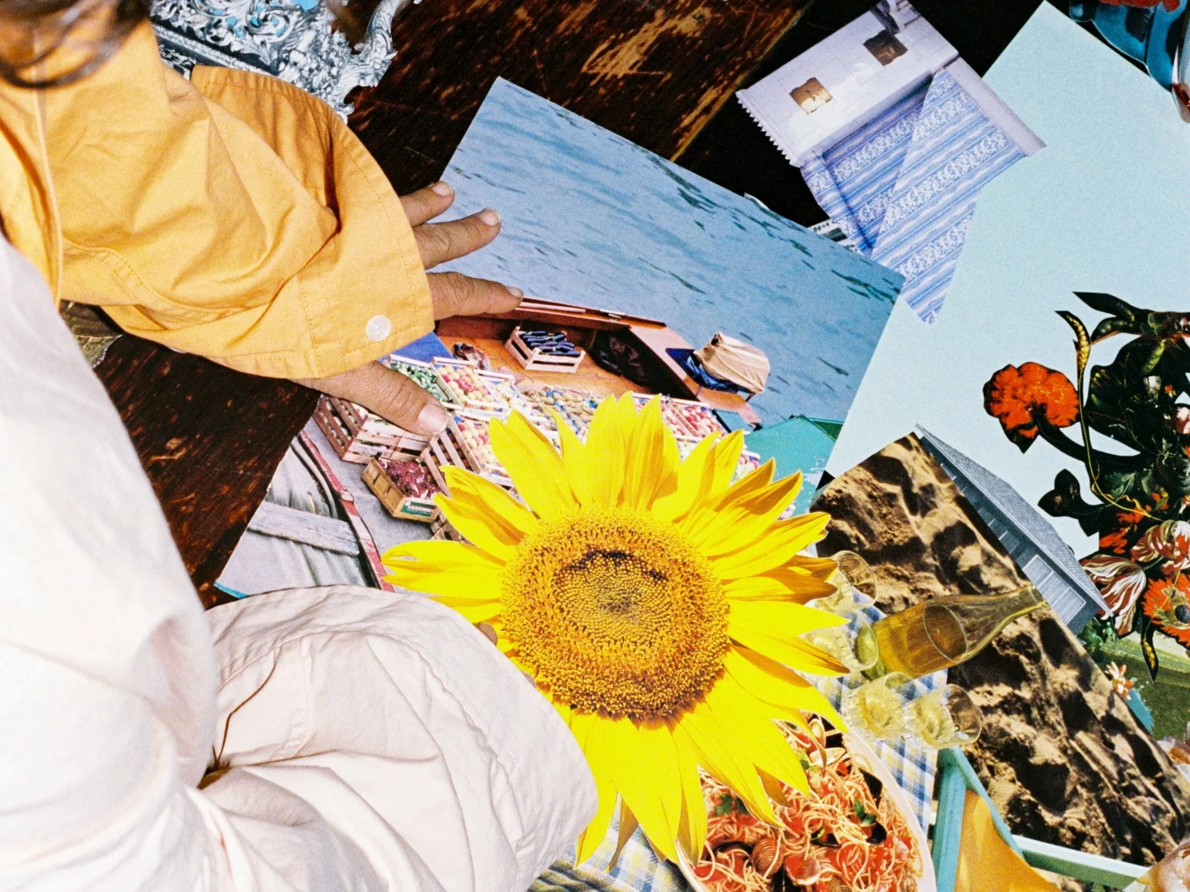 Film photo of hand holding a bunch of brightly coloured poppies
