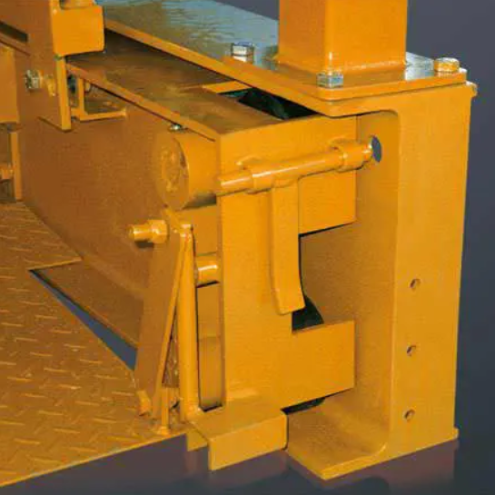 Crane loading platform that is retractable fully retracted. The lock system is showing in the picture. The structure is orange.