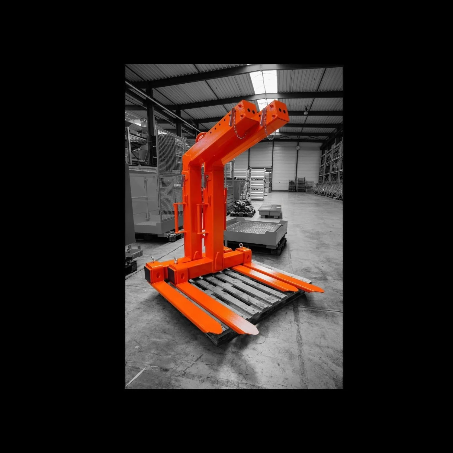 Self Shifting Crane forks in orange on a black and white background