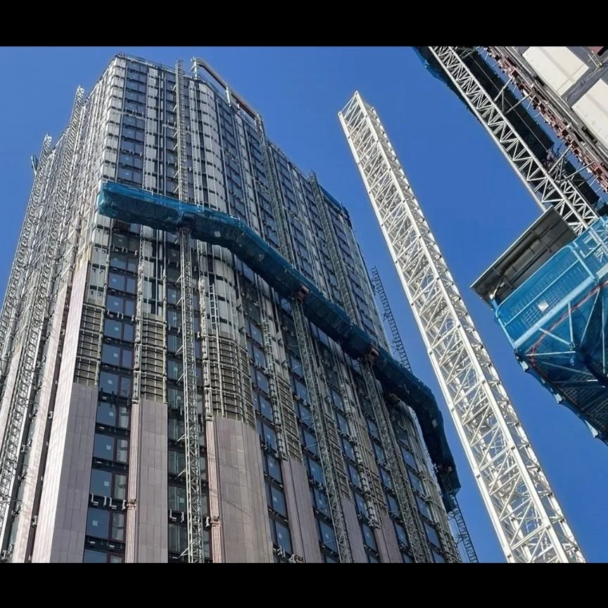 Three mast climbers including wrapping around the building.jpg