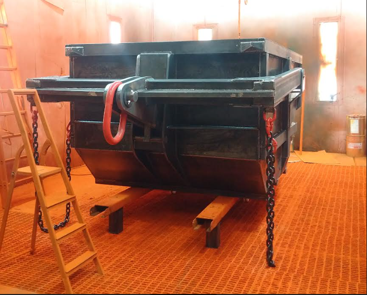 Eichinger heavy duty 10 yard dump bocs used to move construction debris with crane hooks. This dump box is unpainted and in the factory ready for paint.