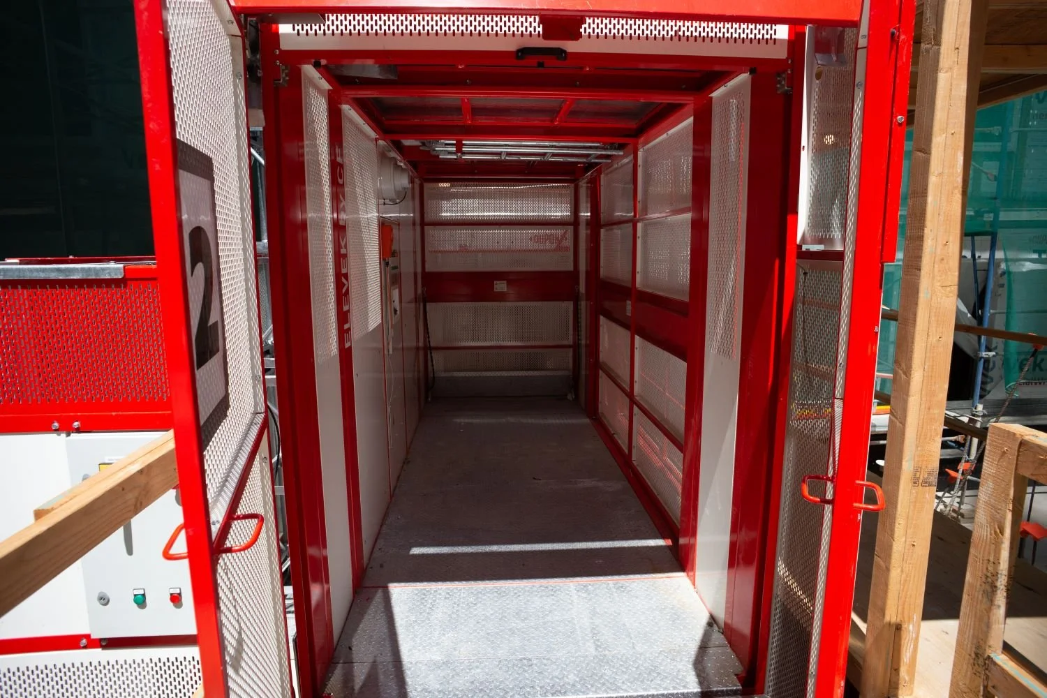 Personnel Hoist used for materials as well to lift equipment and personnel. The inside of the cabin is red and white.