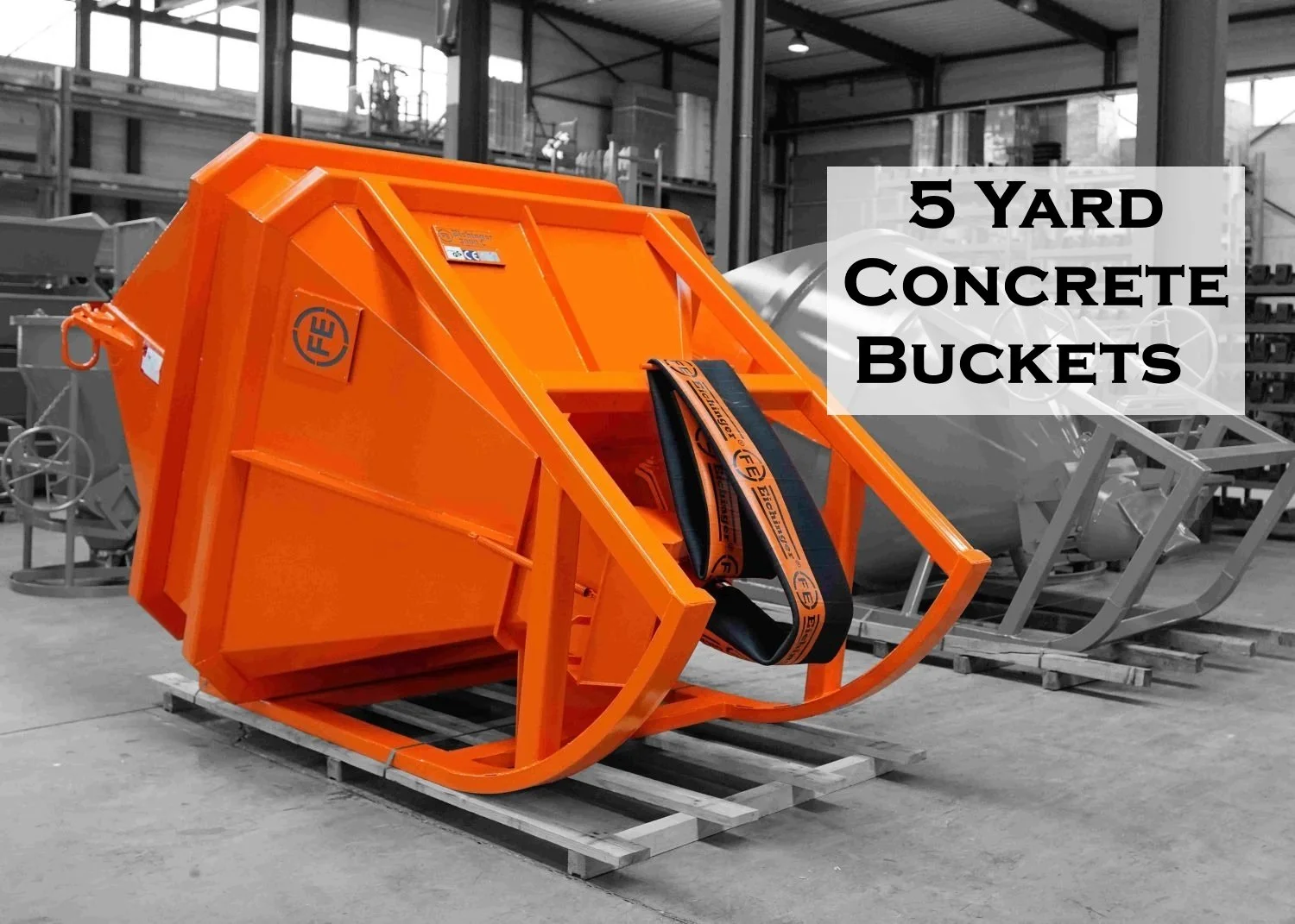 5 yard laydown concrete bucket in orange at the factory awaiting shipping