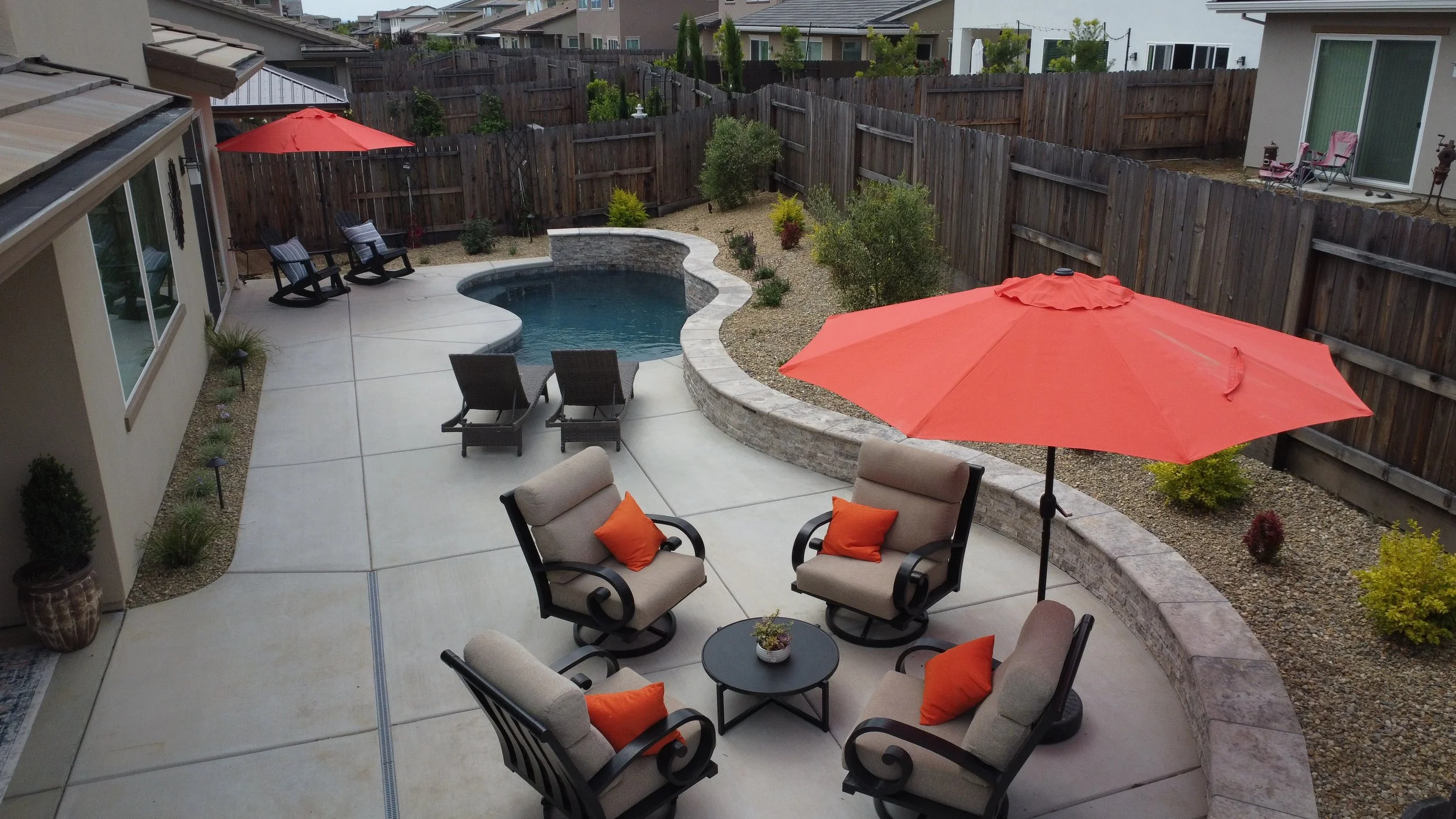 Backyard paradise with pool, custom wall and landscape
