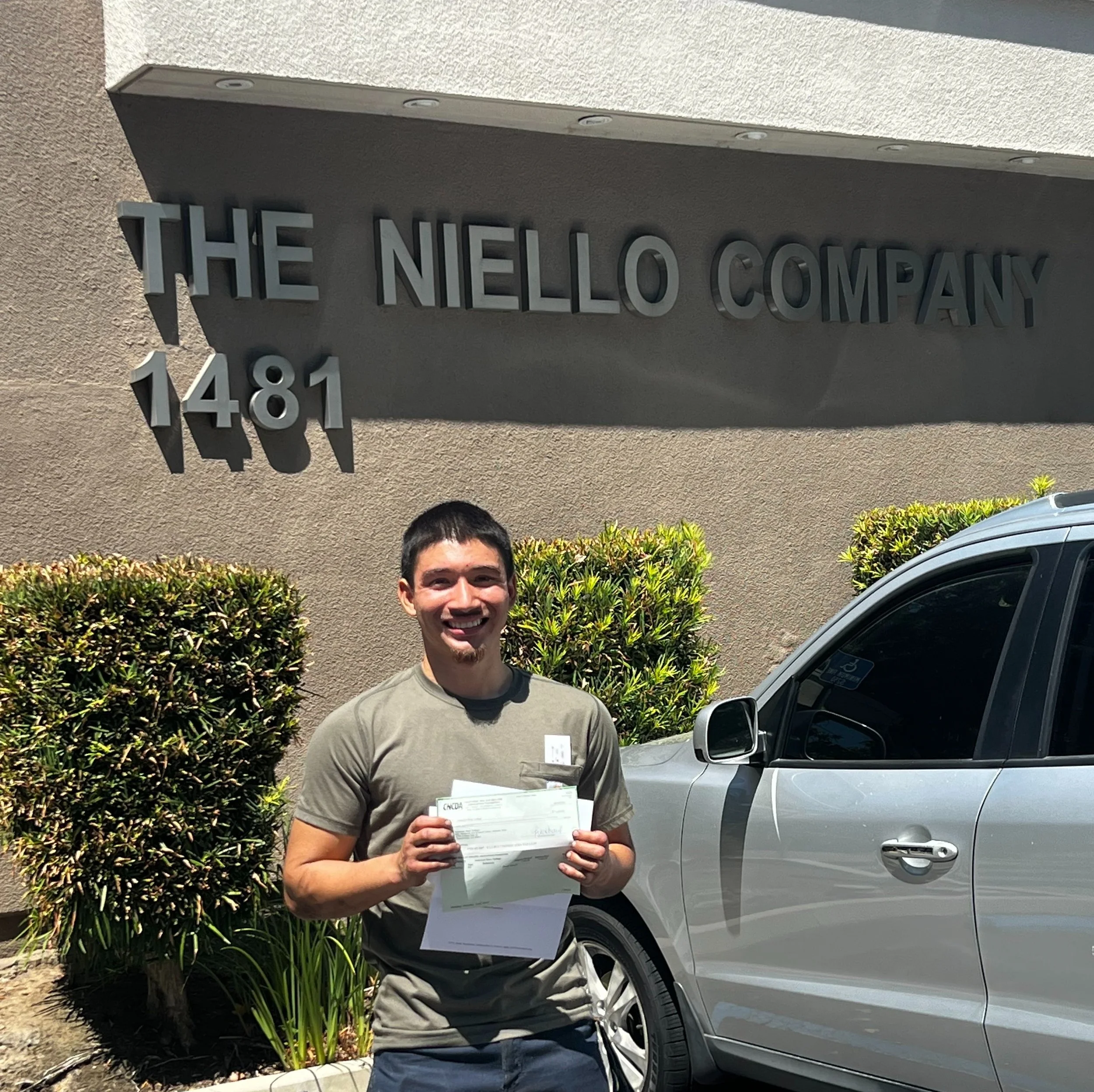 The Niello Company Scholarship Winner Cesar recieving his check