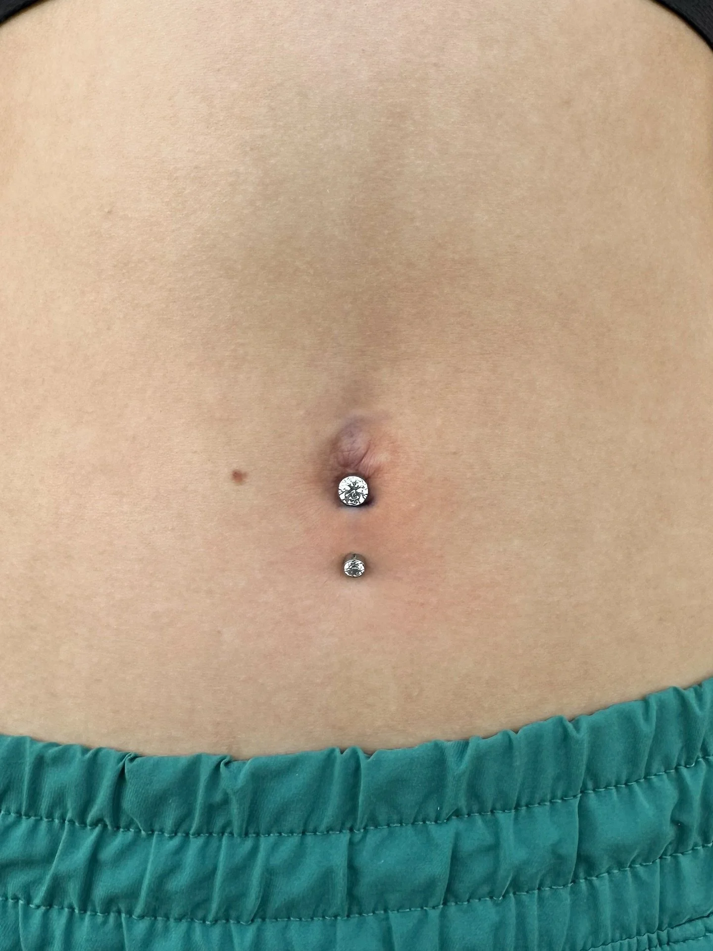 Lower navel done by @darby.pokes