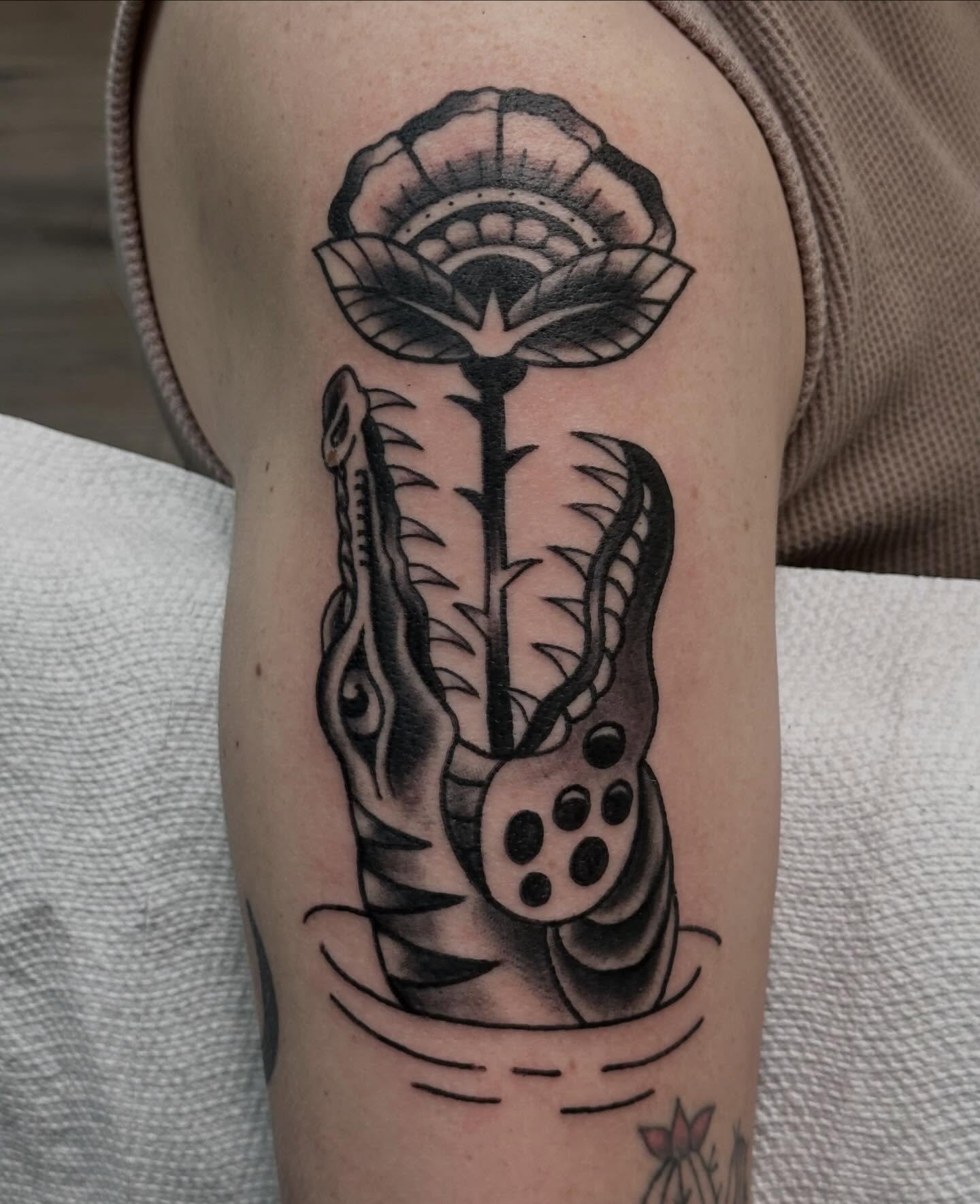 Swamp puppy 🐊 done by @shanemccormicktattoos 
Here 12-8 daily! 
Walk-ins welcome
(318)-562-3021☎️
See ya soon!