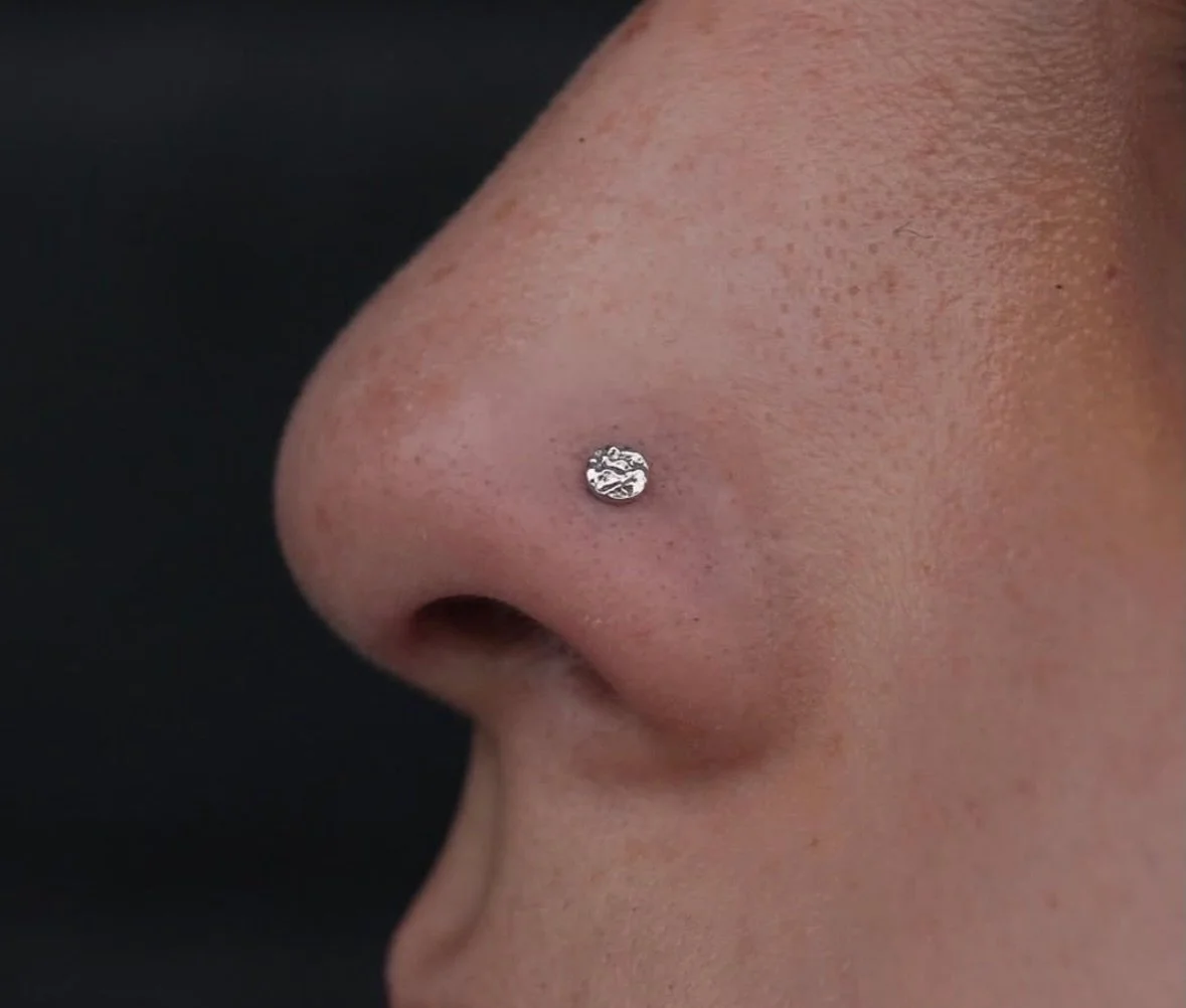 White Gold hammered disk for this nose piercing done by @darby.pokes