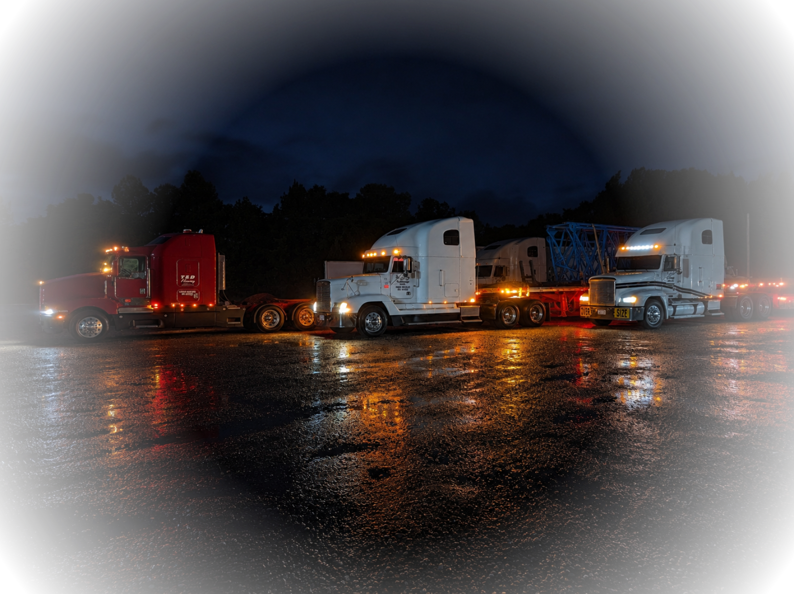 Semis in a parking lot at night