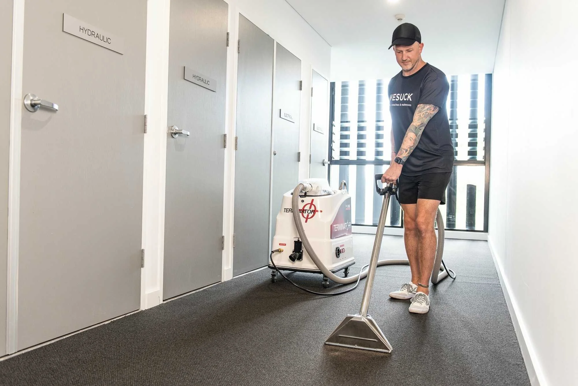 WeSuck cleaner steam cleaning carpet in an Eastern Suburbs apartment hallway