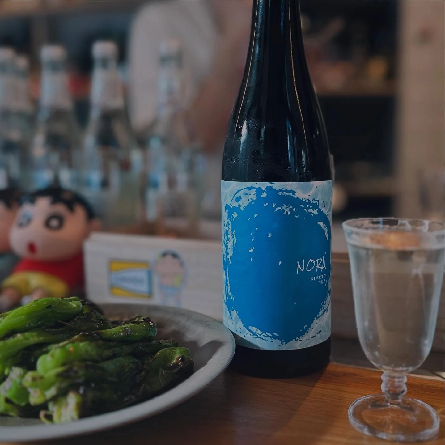 Introducing our newest sake addition &mdash; Kawatsuru Nora Kimoto Nama Genshu.

This expressive sake reveals elegant notes of pear, chrysanthemum flower, and cut mushroom, balanced by a gentle sweetness and a complex, savoury palate. A long, lingeri