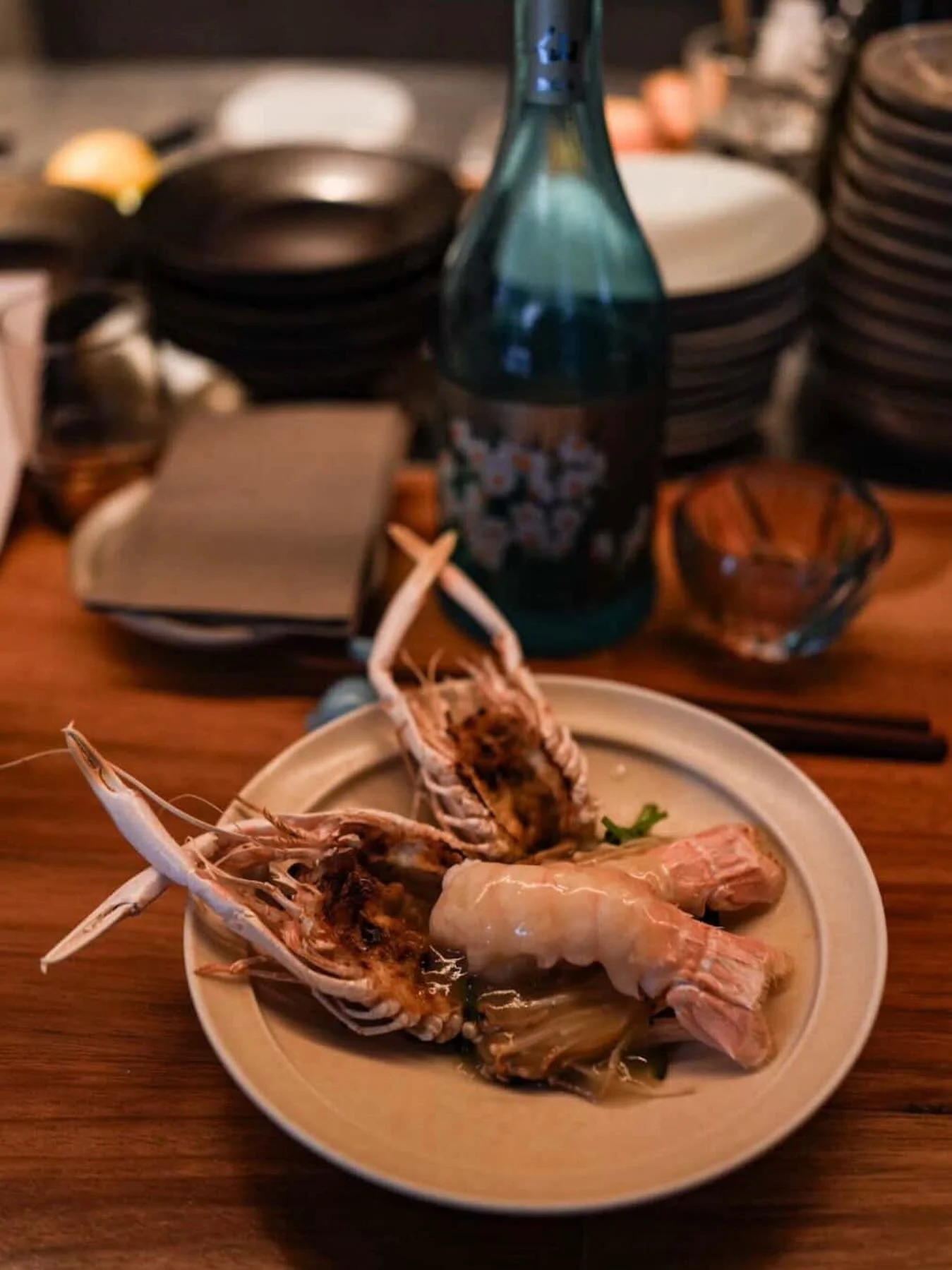 Lightly grilled WA scampi with smoked white soy emulsion, charred enoki and spinach.