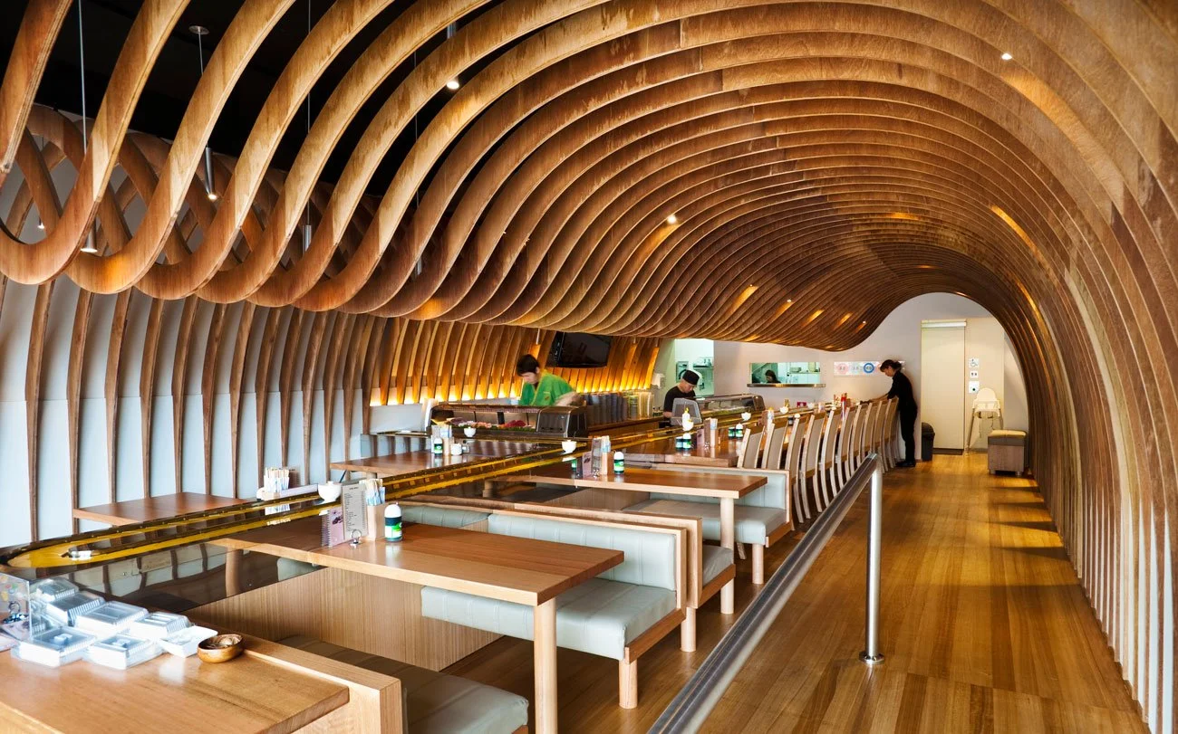 Custom CNC-shaped acoustic plywood beams at The Cave Restaurant Maroubra by Koichi Takada Architects