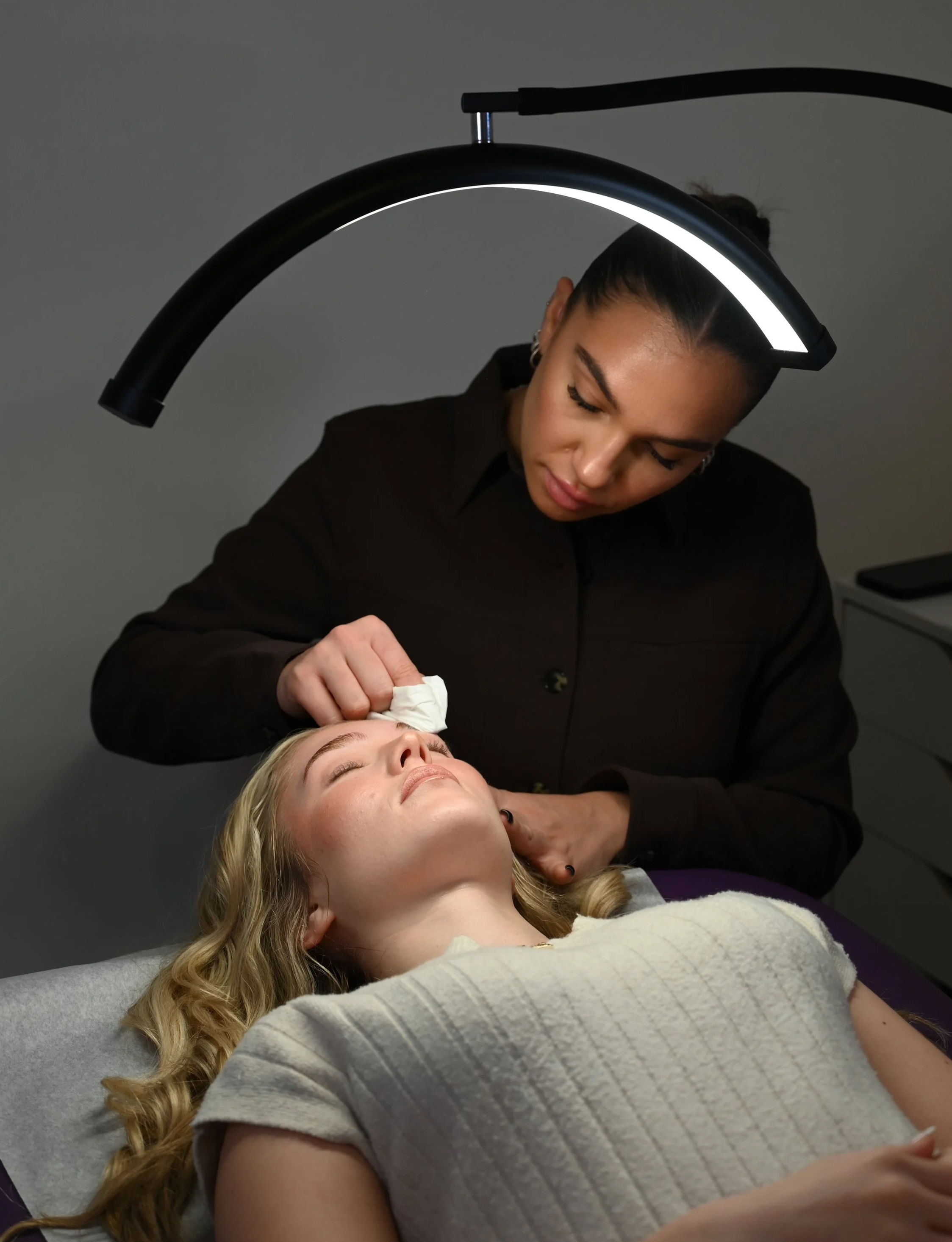 This image highlights an in-person beginner lash training course held at a luxury lash studio in Westchester County, New York, designed for aspiring lash artists.