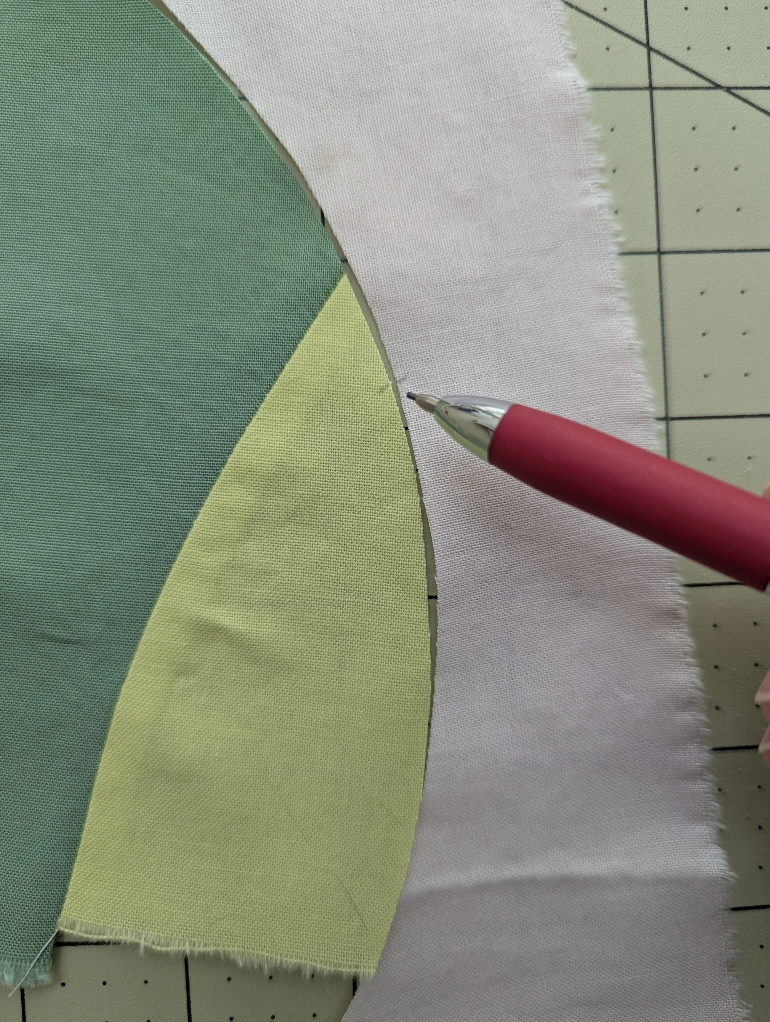 Making a small mark to line up pieces for curved improv piecing
